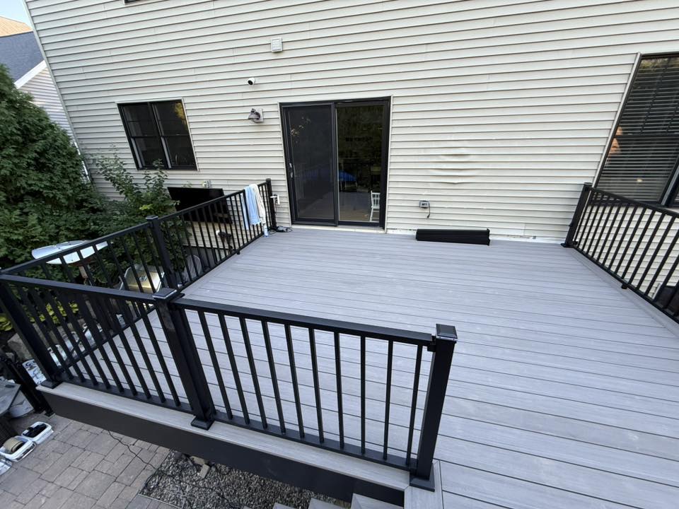 Gray composite deck attached to home